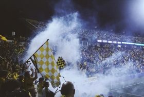 Football Fans Celebrate Team Victory on City Streets