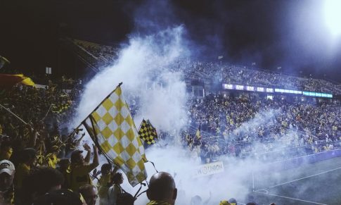 Football Fans Celebrate Team Victory on City Streets